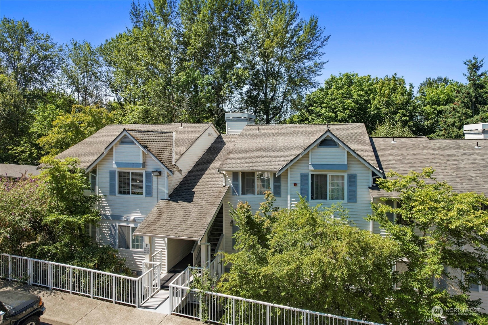 949 Aberdeen Avenue Northeast, Unit E216 Renton, WA 98056 - Photo 2 of 23 a house with trees in the background