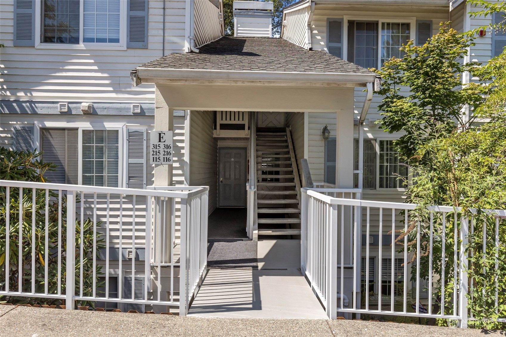 949 Aberdeen Avenue Northeast, Unit E216 Renton, WA 98056 - Photo 3 of 23 a front view of a house with a porch