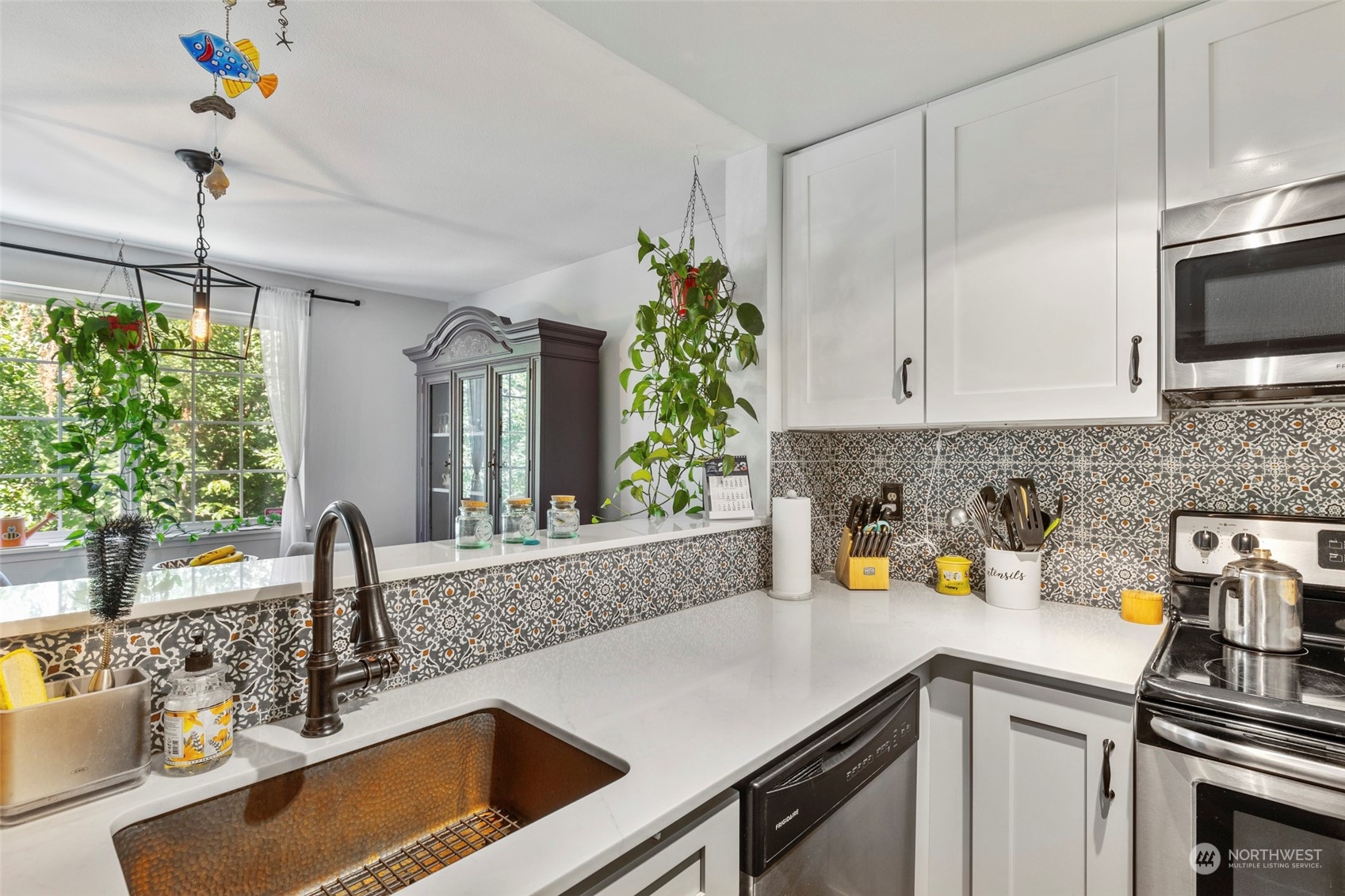 949 Aberdeen Avenue Northeast, Unit E216 Renton, WA 98056 - Photo 8 of 23 a kitchen with a sink and cabinets
