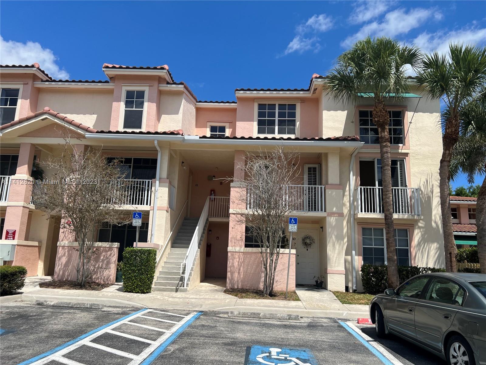 a view of a car park in front of a building