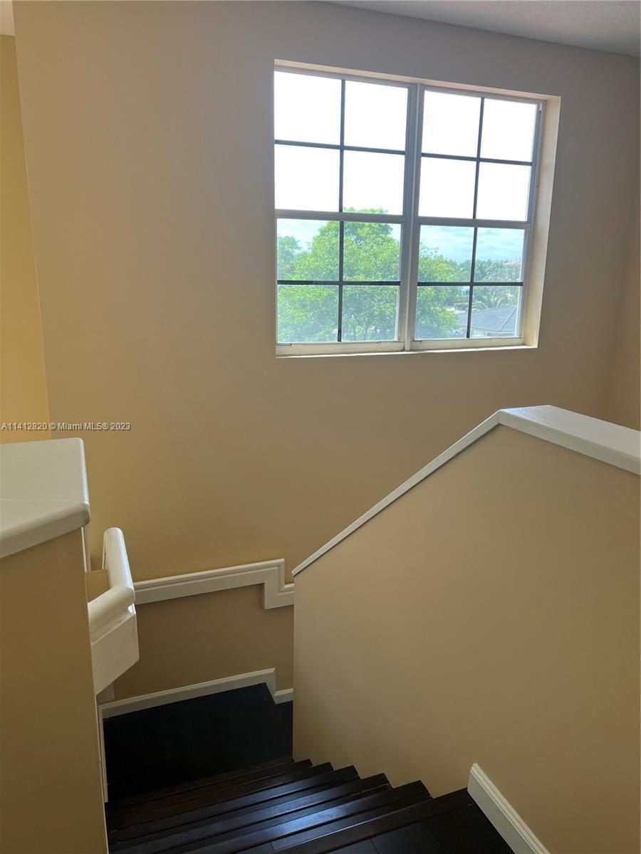 4812 Central Boulevard, Unit 20 Jupiter, FL 33458 - Photo 14 of 24 a view of small space with racks on the wall and a window