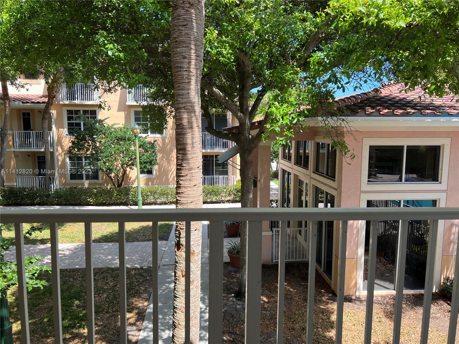 4812 Central Boulevard, Unit 20 Jupiter, FL 33458 - Photo 21 of 24 a house view with a garden