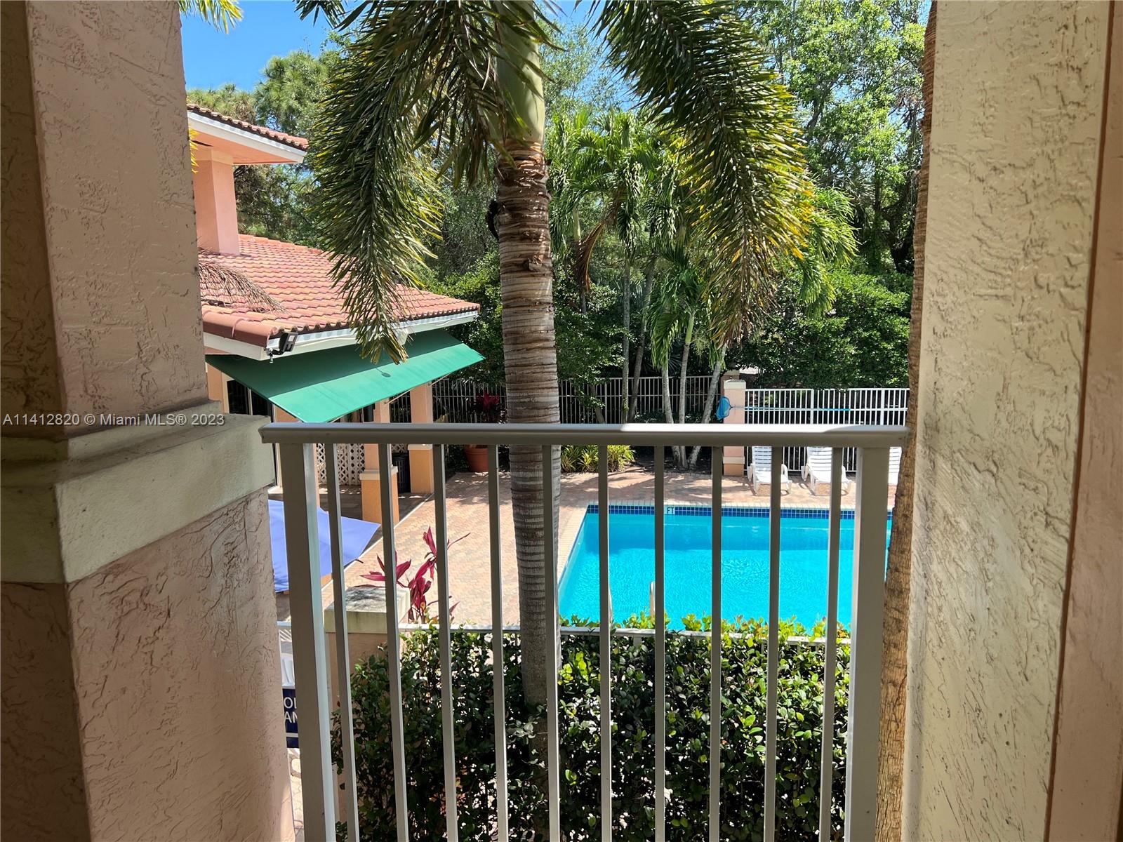 4812 Central Boulevard, Unit 20 Jupiter, FL 33458 - Photo 22 of 24 a view of a house with backyard and deck