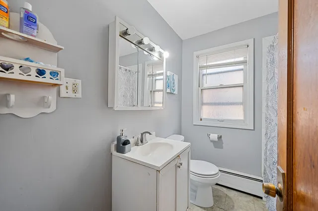 a bathroom with a sink toilet and vanity