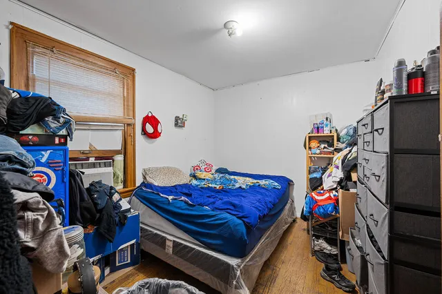 a bed room with a bed and a window