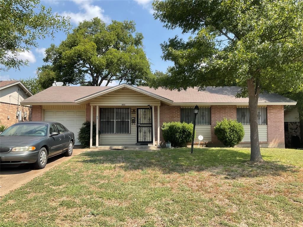 631 Oceanview Drive Dallas, TX 75232 - Photo 2 of 2 a front view of a house with a yard