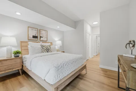 a bedroom with a bed and a table