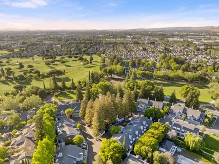 an aerial view of residential building with parking space