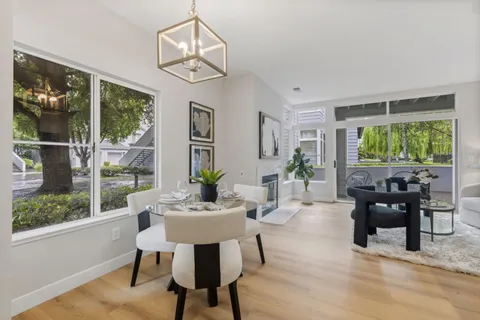 a view of a dining room with furniture window and outside view