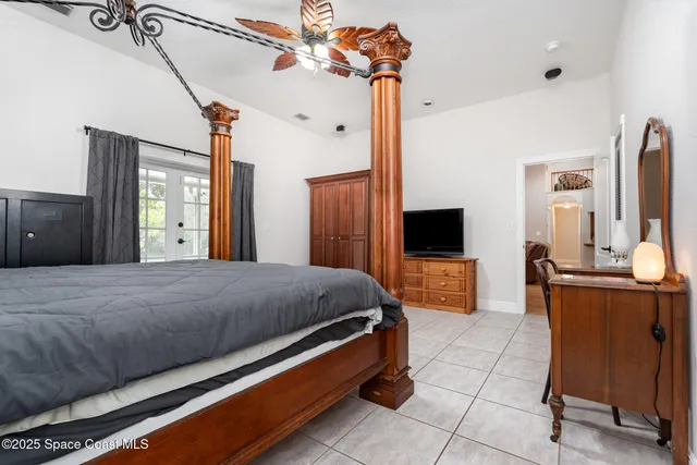 a bathroom with a granite countertop tub sink and mirror