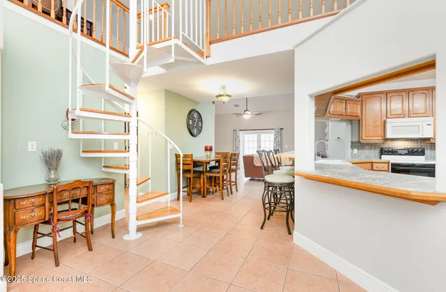 a living room filled with furniture and a large window