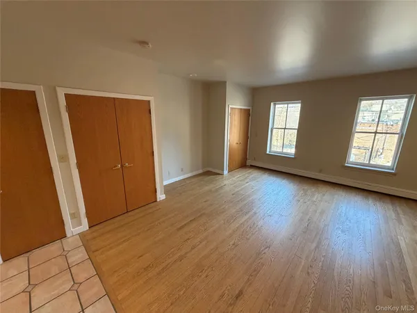 a kitchen with stainless steel appliances granite countertop a sink a stove a refrigerator and cabinets