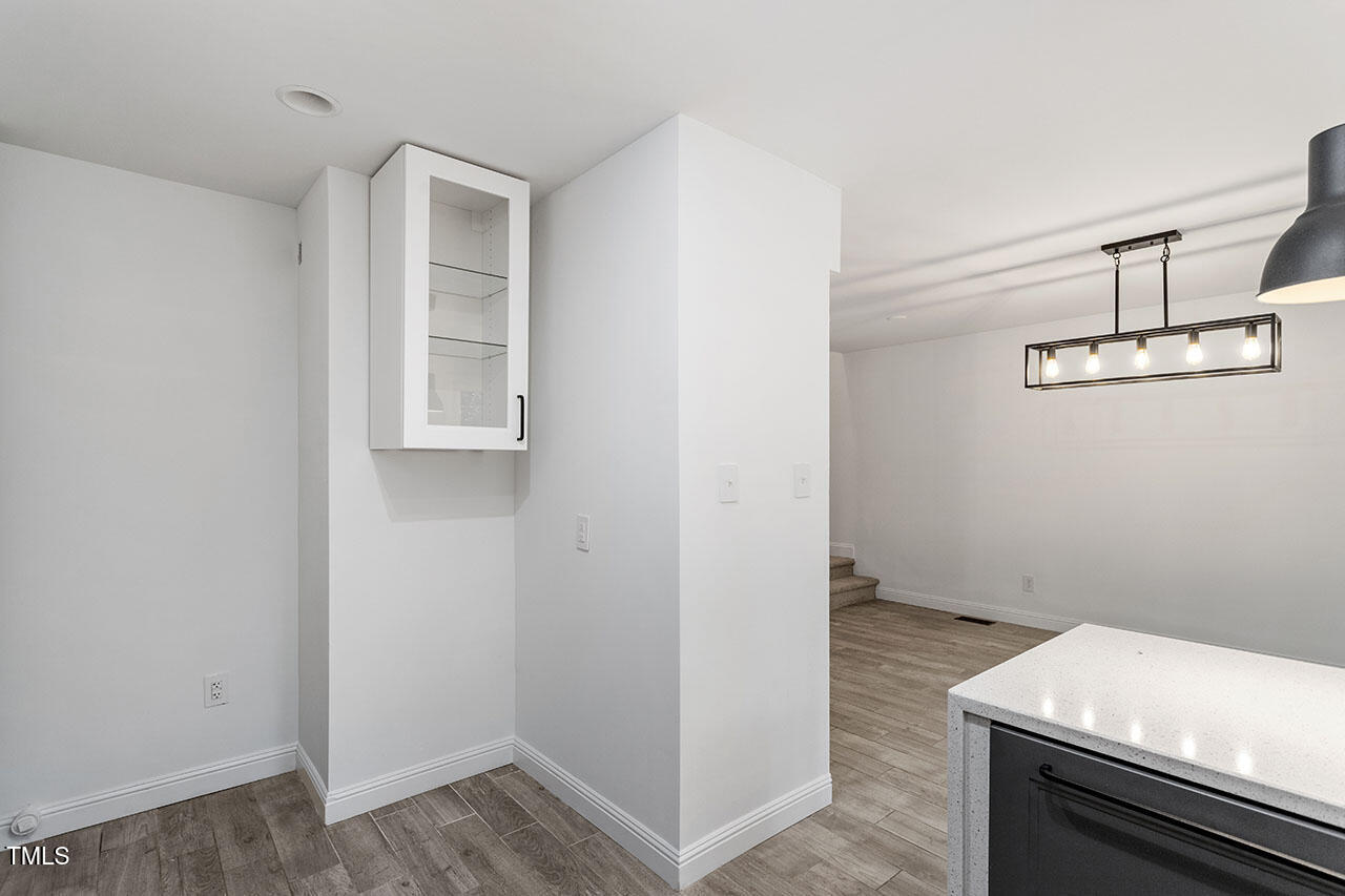 1016 North Bend Drive Raleigh, NC 27609 - Photo 13 of 36 a view of kitchen and utility room