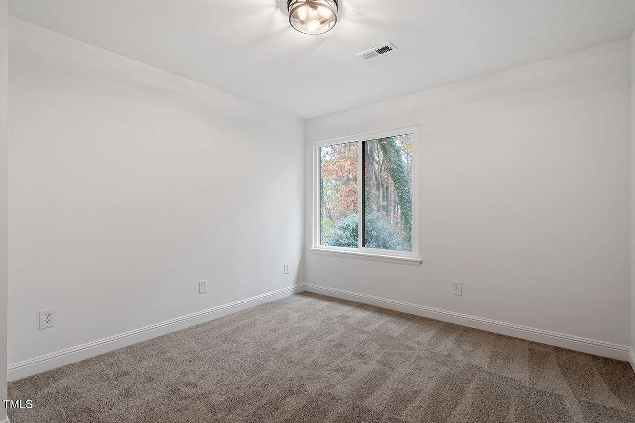 1016 North Bend Drive Raleigh, NC 27609 - Photo 20 of 36 an empty room with windows