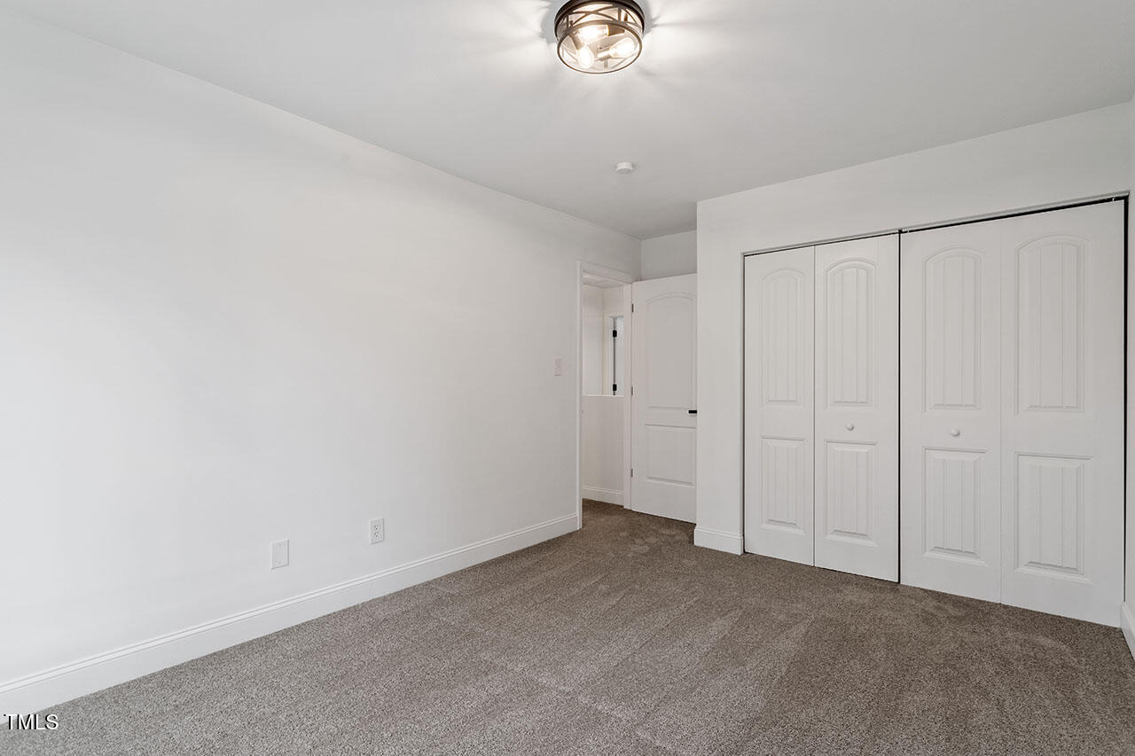 1016 North Bend Drive Raleigh, NC 27609 - Photo 23 of 36 a view of an empty room