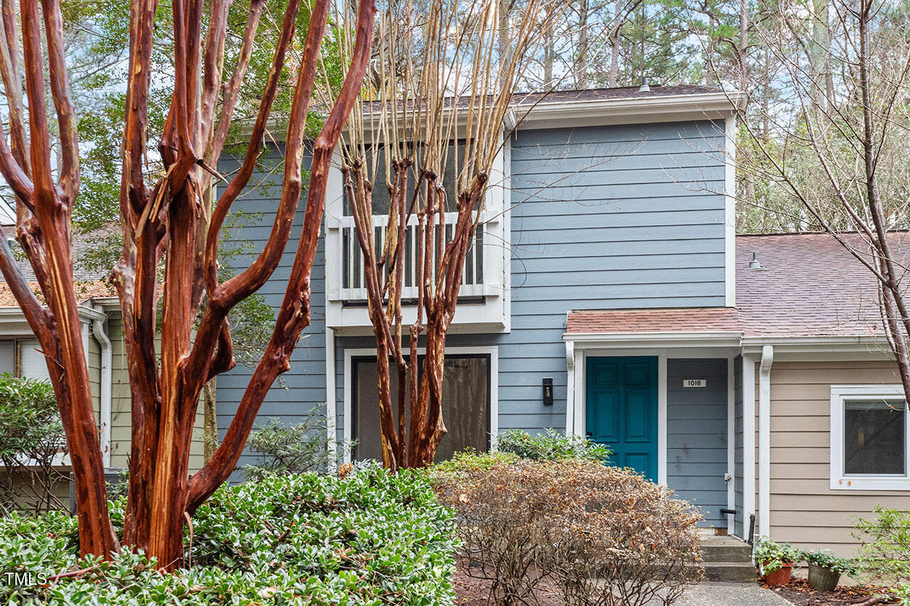 1016 North Bend Drive Raleigh, NC 27609 - Photo 27 of 36 a front view of a house with a tree
