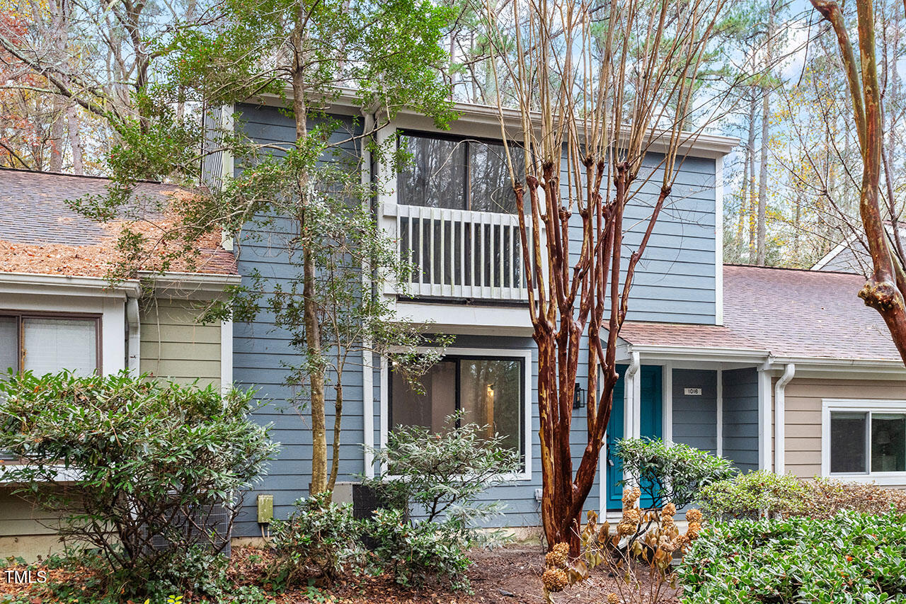 1016 North Bend Drive Raleigh, NC 27609 - Photo 28 of 36 a front view of a house with a tree