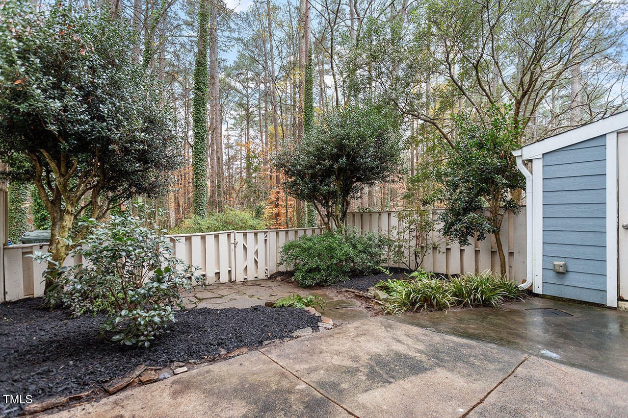 1016 North Bend Drive Raleigh, NC 27609 - Photo 30 of 36 a front view of a house with a garden