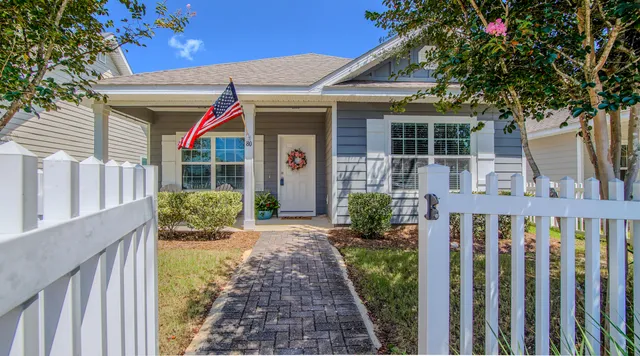 a front view of house with small garden