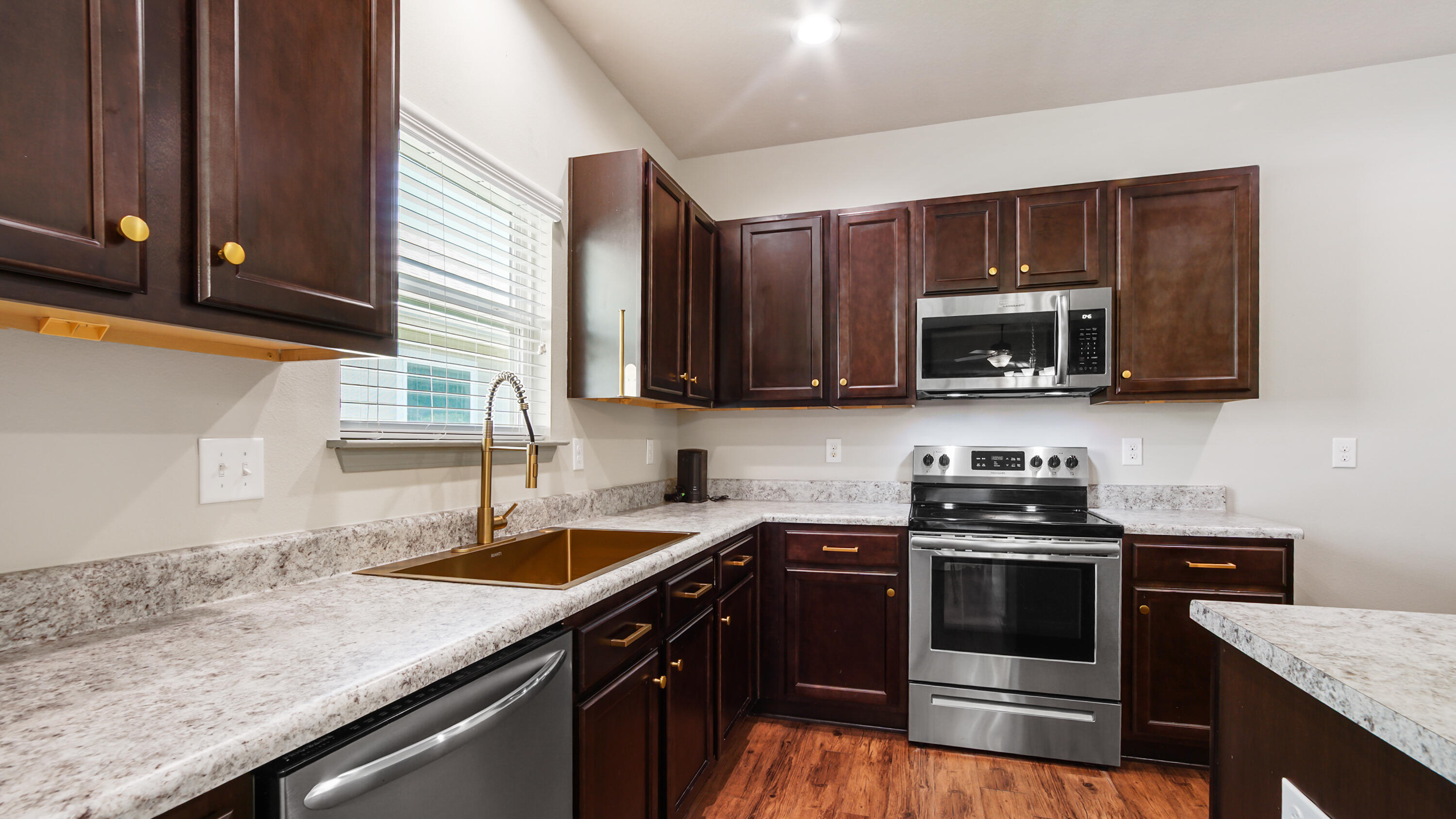 80 Sarona Street Freeport, FL 32439 - Photo 13 of 65 a kitchen with stainless steel appliances granite countertop a sink stove and microwave