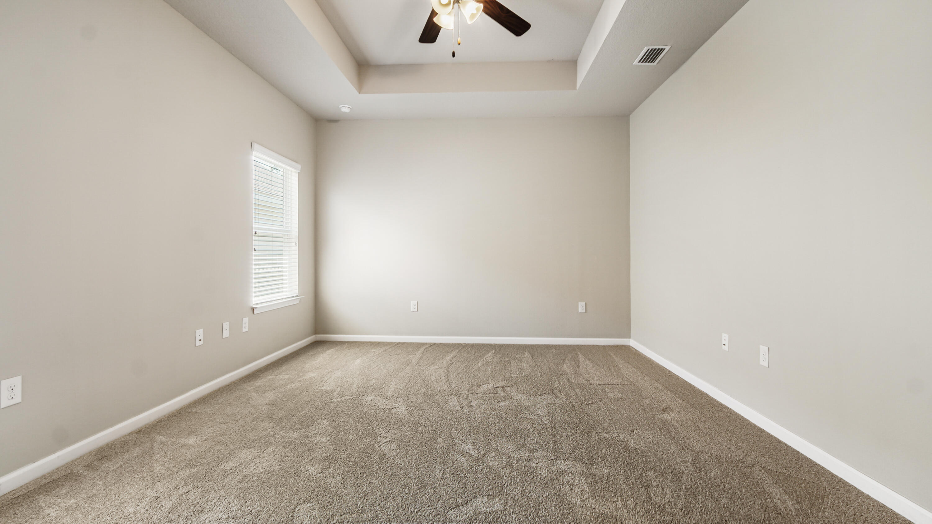 80 Sarona Street Freeport, FL 32439 - Photo 16 of 65 an empty room with a windows and a ceiling fan