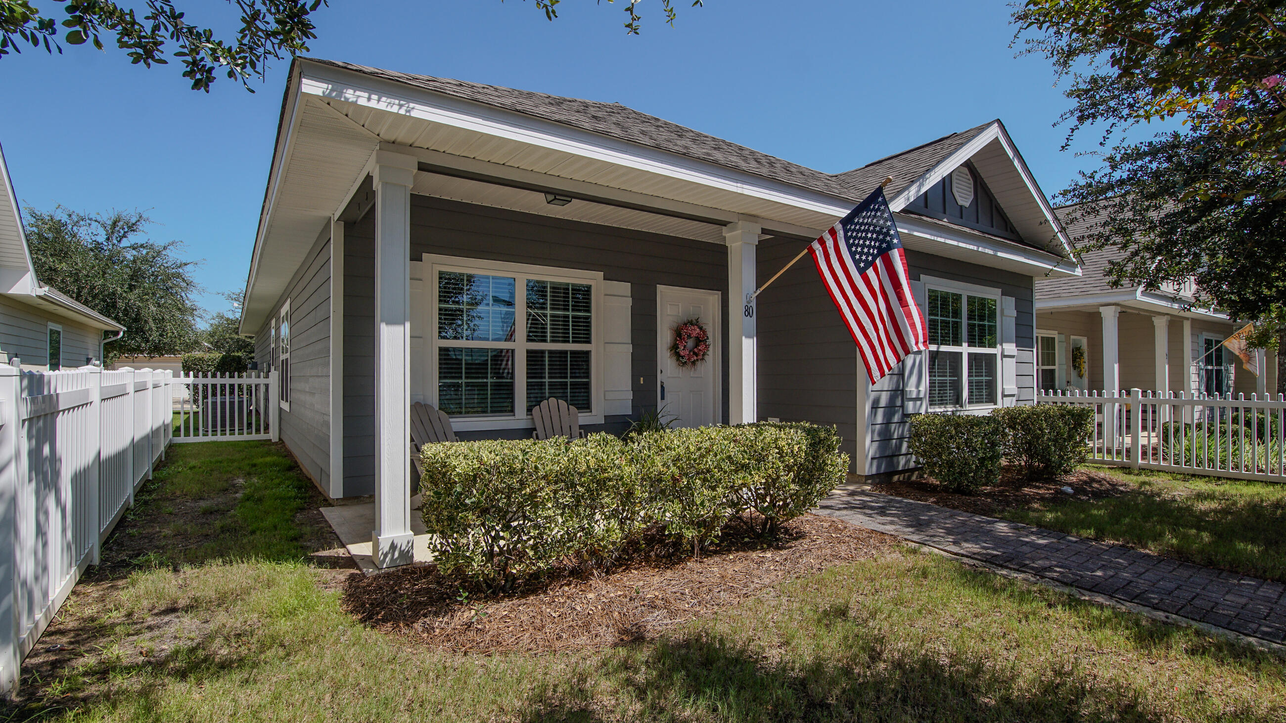 80 Sarona Street Freeport, FL 32439 - Photo 2 of 65 a front view of a house with garden