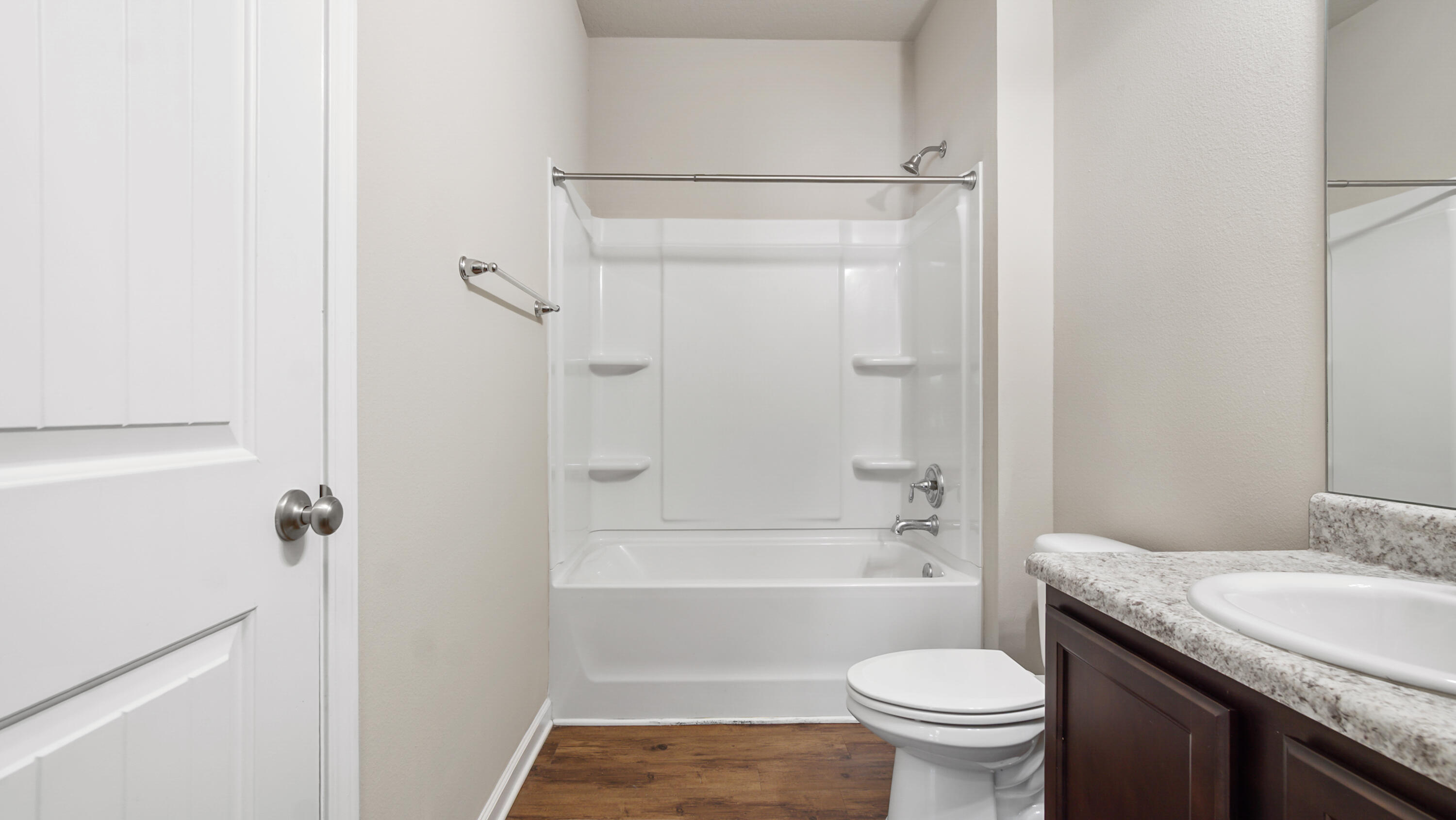 80 Sarona Street Freeport, FL 32439 - Photo 29 of 65 a bathroom with a granite countertop toilet sink and shower