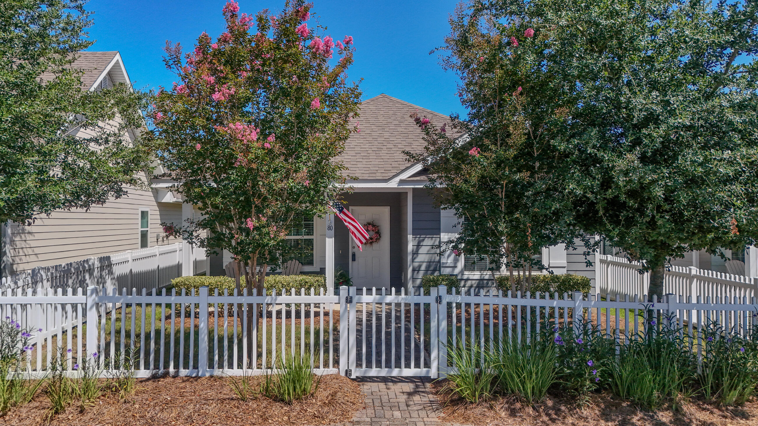 80 Sarona Street Freeport, FL 32439 - Photo 35 of 65 a view of a house with a small yard and wooden fence