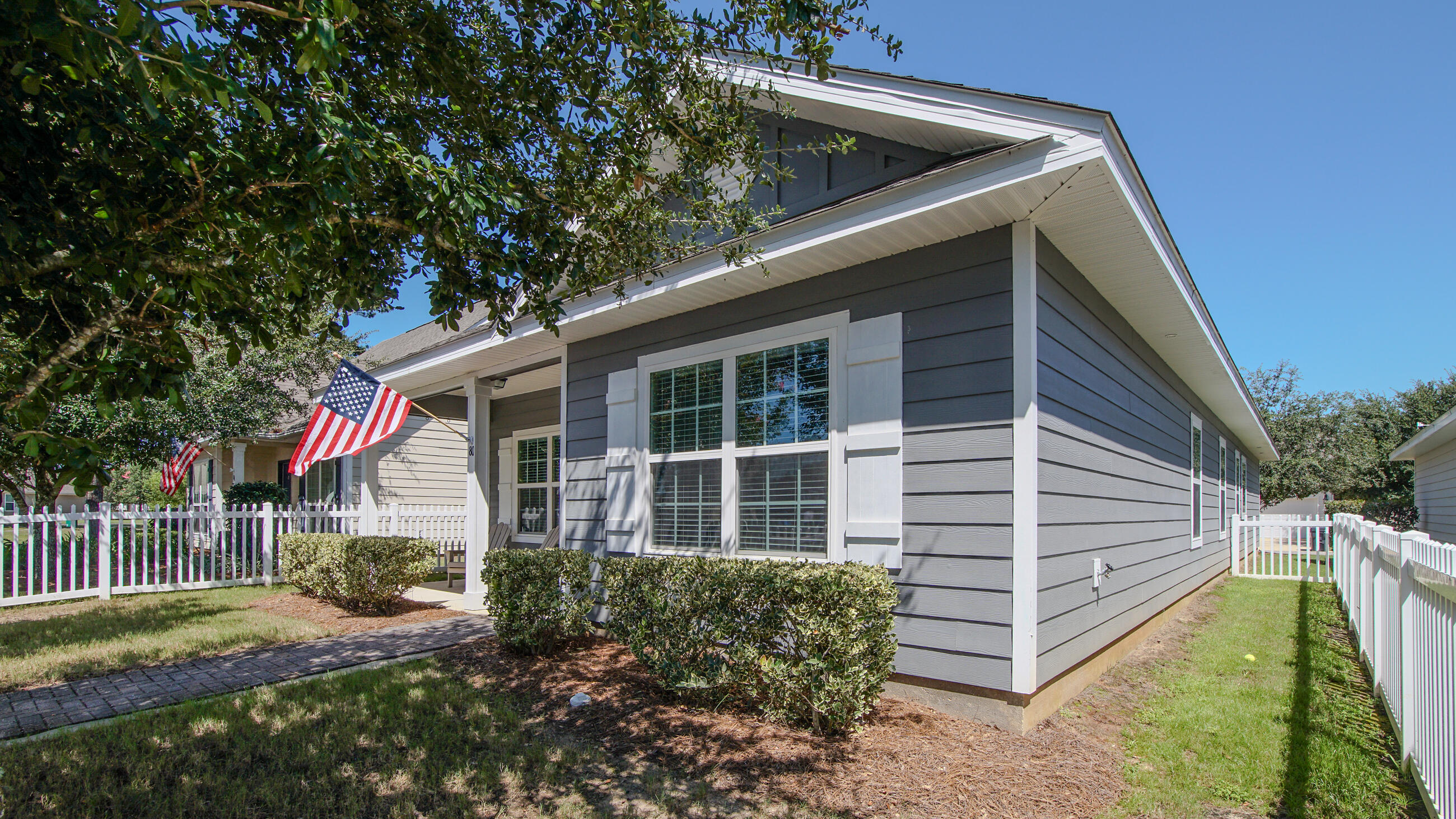 80 Sarona Street Freeport, FL 32439 - Photo 38 of 65 a front view of a house with garden