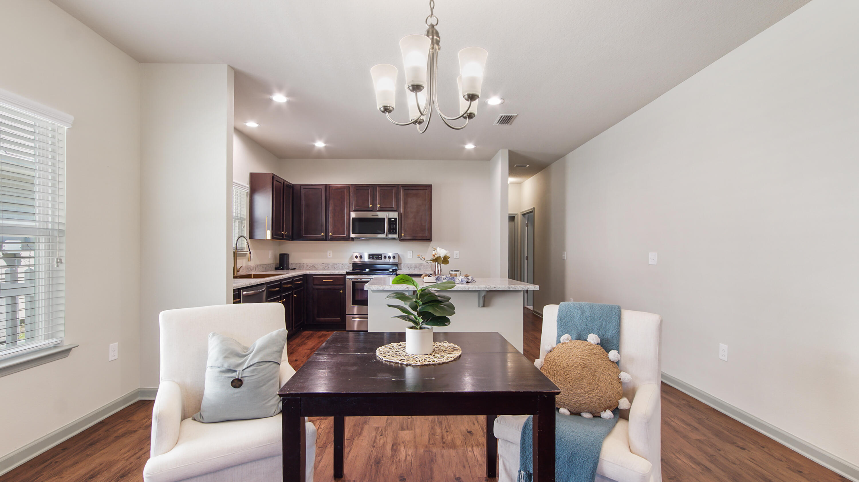80 Sarona Street Freeport, FL 32439 - Photo 5 of 65 a view of a dining room with furniture and wooden floor