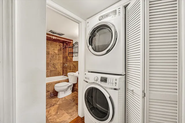 a view of a hallway with washer and dryer