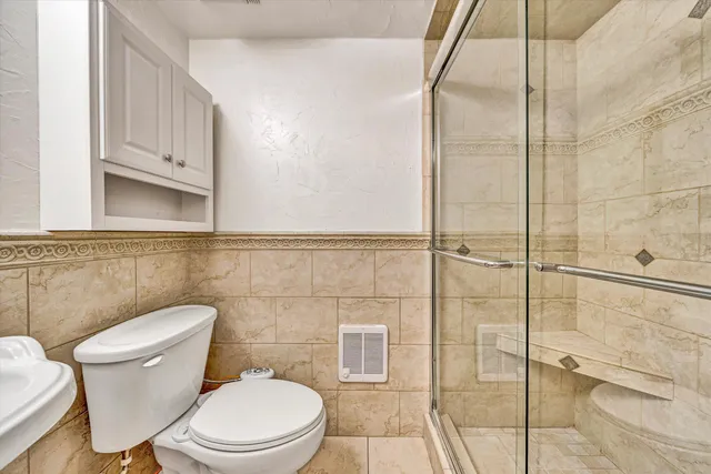 a view of a brick house with a yard