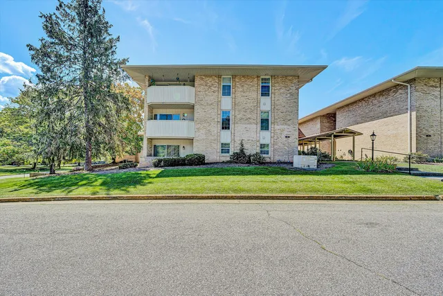 a view of a garden with sitting area
