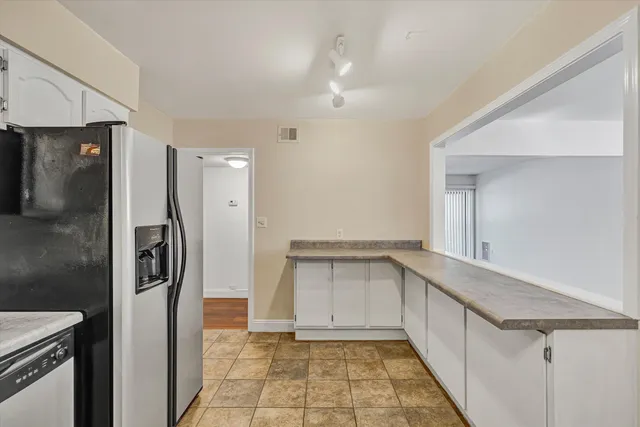 a bathroom with a shower and a sink