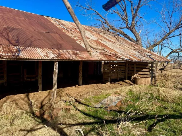 a view of a yard and mountain view in back