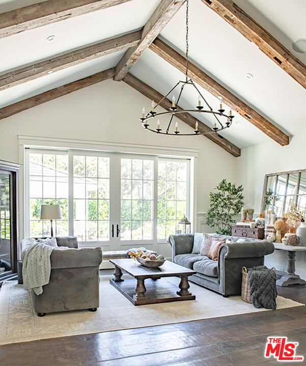 24501 Deep Well Road Hidden Hills, CA 91302 - Photo 2 of 6 a living room with furniture and a large window