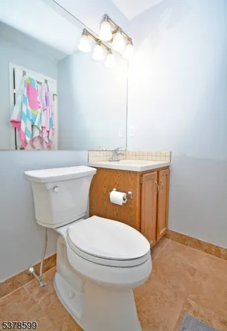 a bathroom with a toilet a sink and a shower