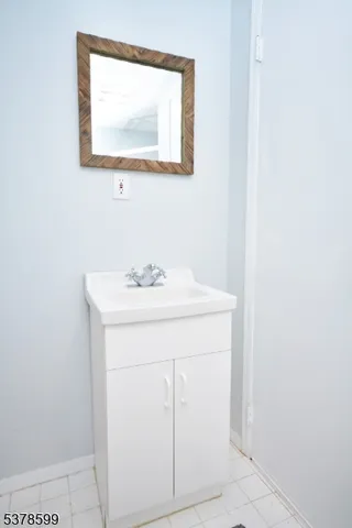 a bathroom with a sink a vanity and a mirror