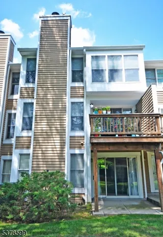 a view of a brick building next to a yard