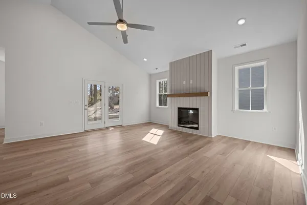 a view of a kitchen with wooden floor and a sink