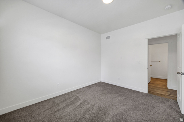 3115 South 200 West, Unit C201 Nibley, UT 84321 - Photo 12 of 23 Spacious room featuring neutral carpeting and white baseboards