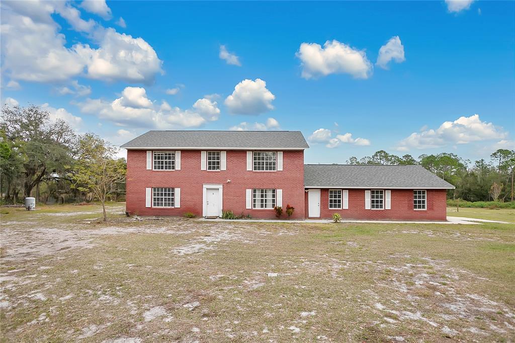 1960 Murray Road Fort Meade, FL 33841 - Photo 1 of 1 a view of a house with a yard