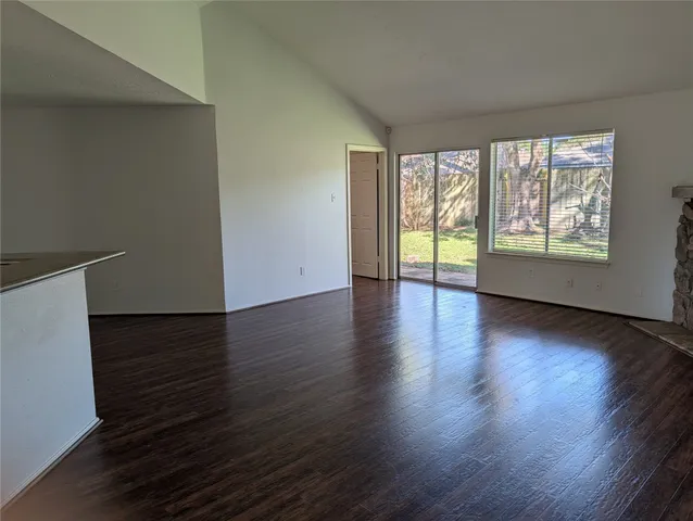 a view of kitchen with wooden floor and window