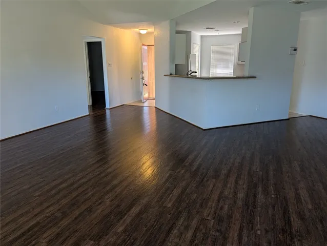 a kitchen with cabinets appliances and a sink