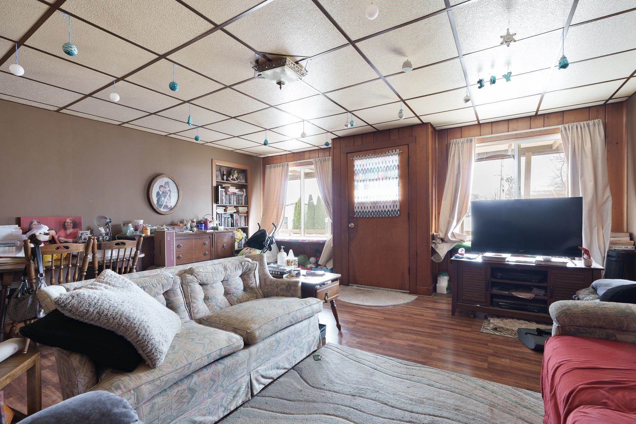 102 North Main Street Leaf River, IL 61047 - Photo 4 of 13 a living room with furniture and a flat screen tv