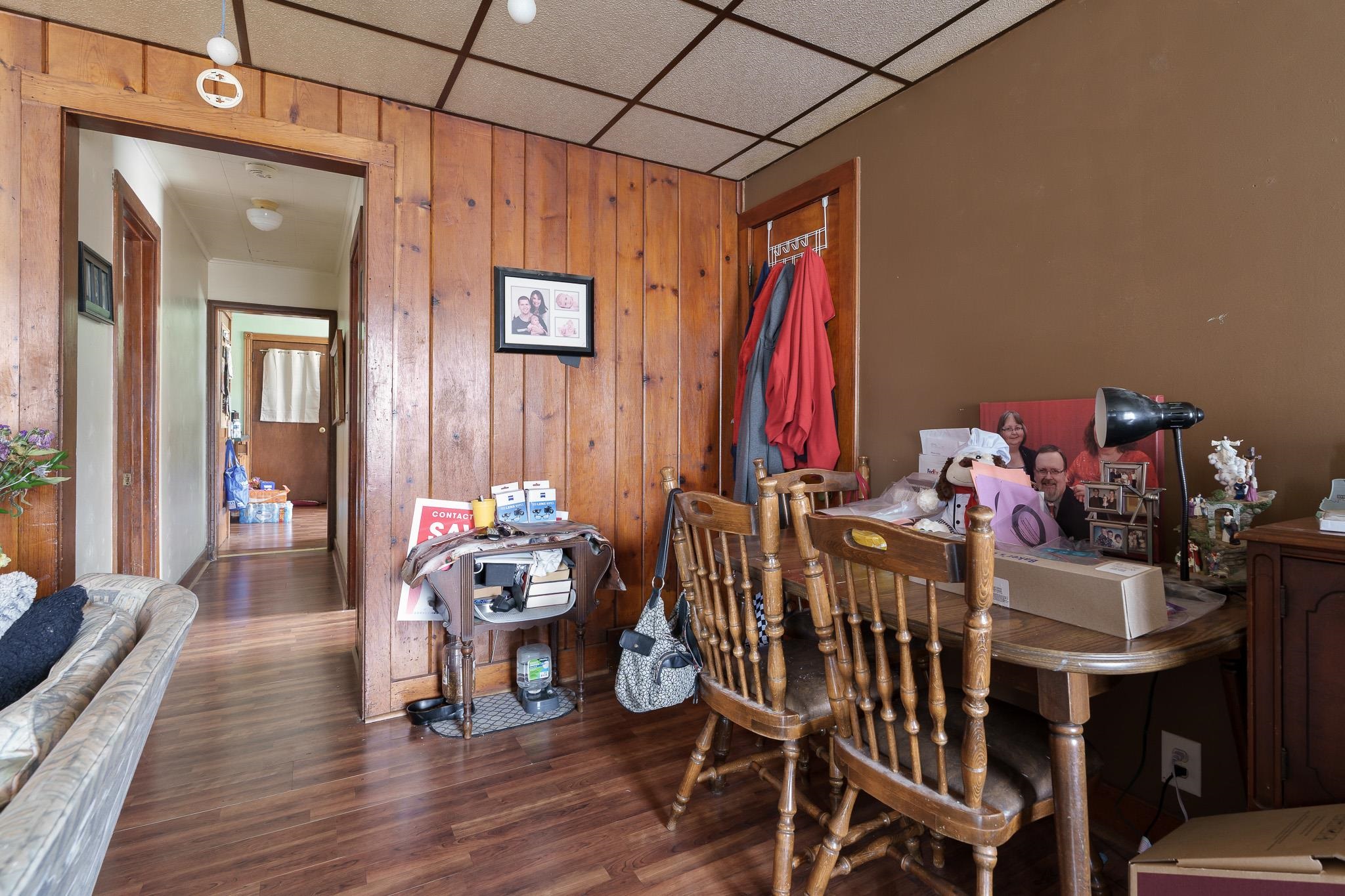 102 North Main Street Leaf River, IL 61047 - Photo 5 of 13 a view of a dining room with furniture and wooden floor