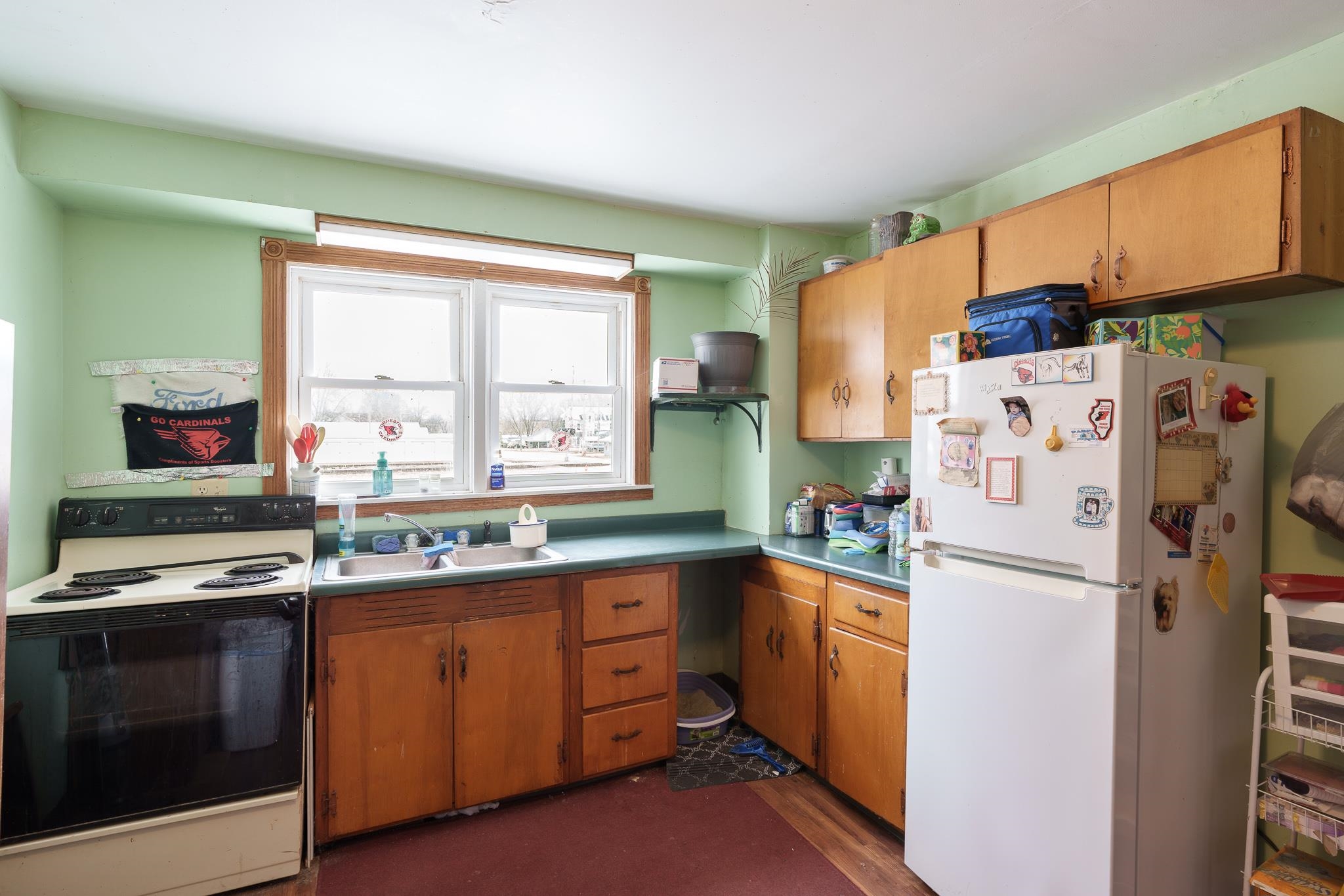 102 North Main Street Leaf River, IL 61047 - Photo 6 of 13 a kitchen with a refrigerator stove and sink