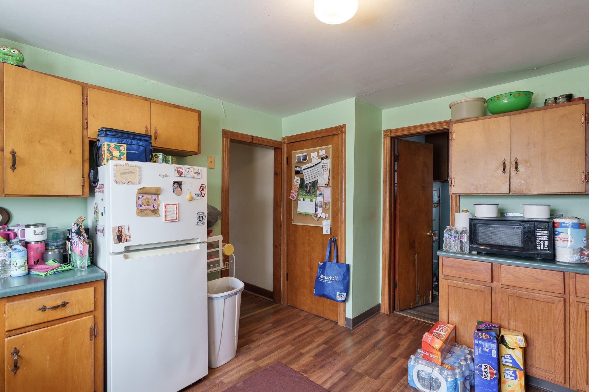 102 North Main Street Leaf River, IL 61047 - Photo 7 of 13 a kitchen with stainless steel appliances a refrigerator and a stove top oven