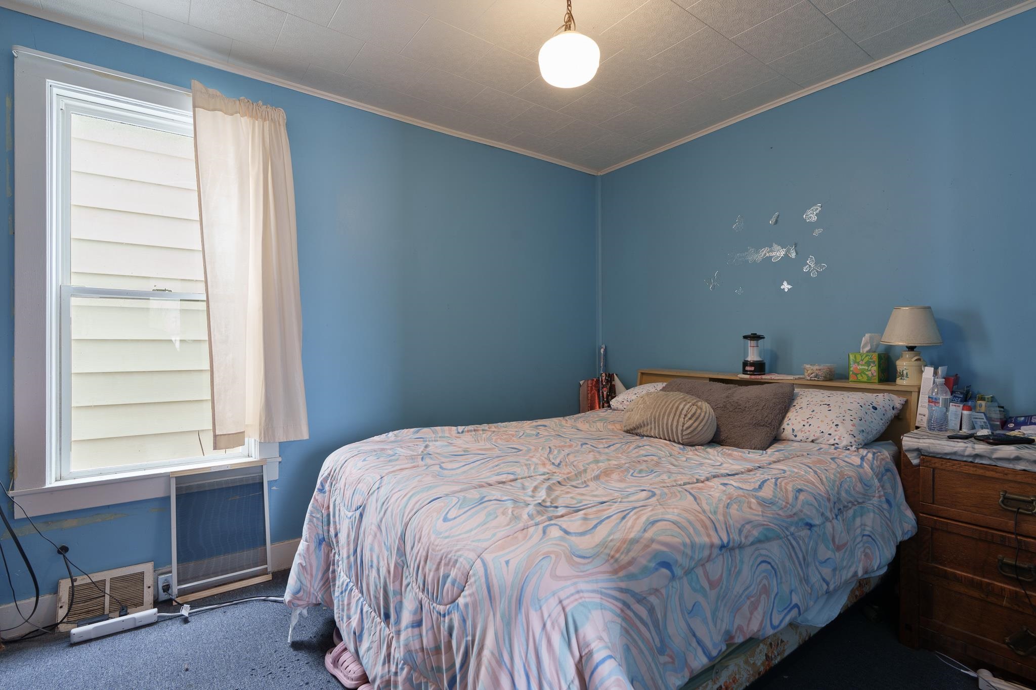 102 North Main Street Leaf River, IL 61047 - Photo 9 of 13 a bedroom with a bed and a window