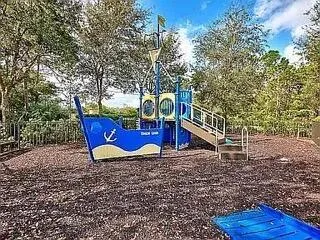 a view of a wooden house with a yard